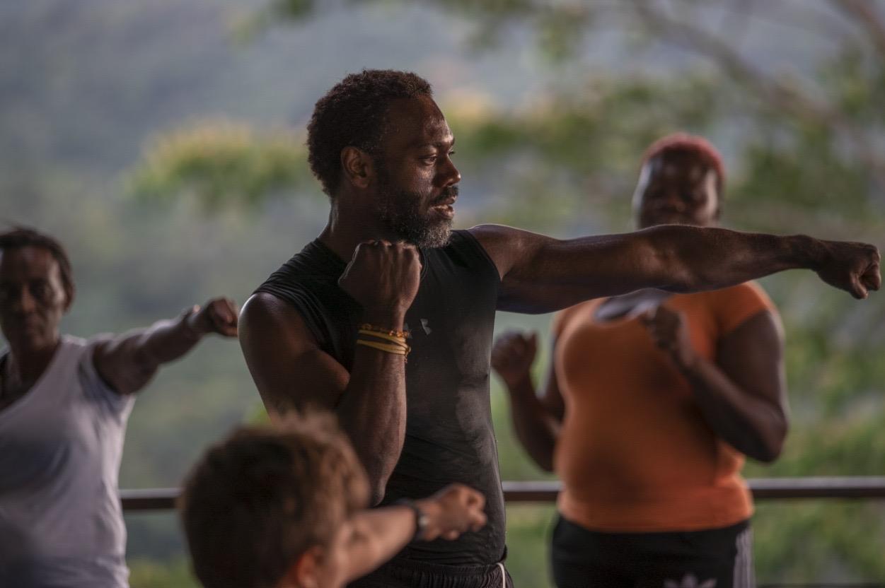 Close-up of Eugene punching with focused intensity